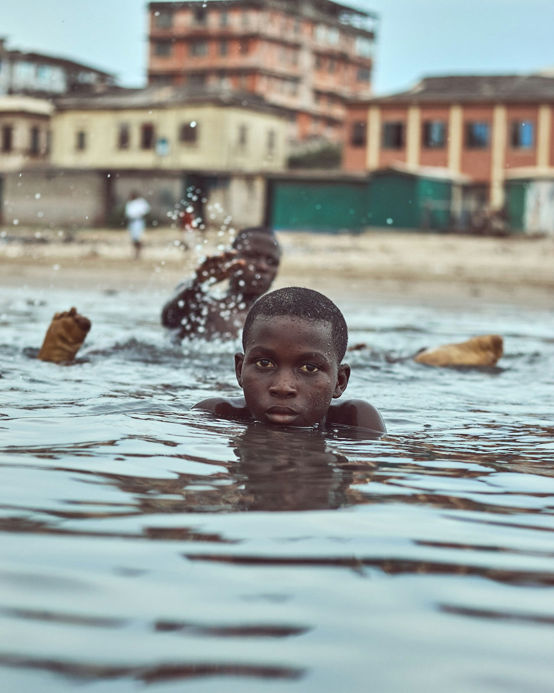 baby in water during daytime
